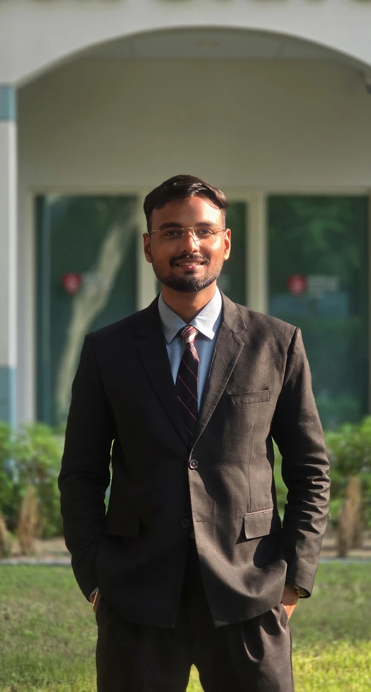 Amresh Shravan Gupta, smiling, in a suit
